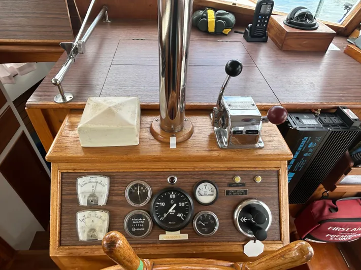 Brie Yacht Photos Pics 1980 Grand Banks 36 Classic helm with gauges, throttle, and navigation equipment.