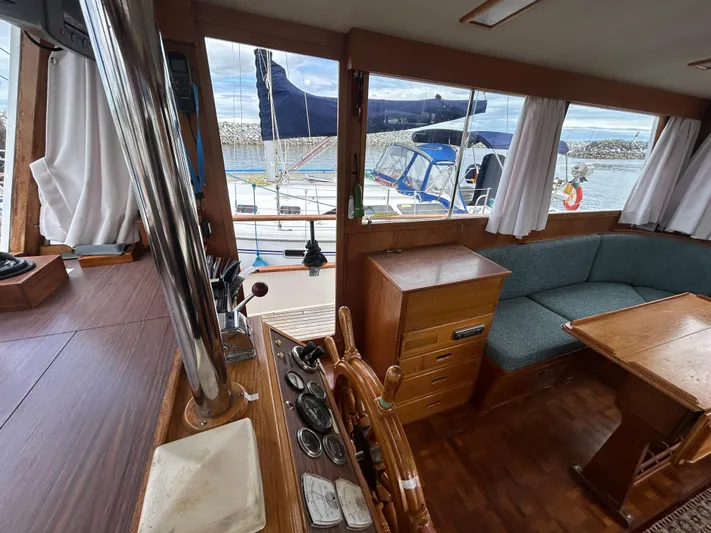 Brie Yacht Photos Pics Interior of 1980 Grand Banks 36 Classic yacht with wooden furnishings and seating area.