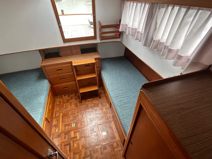 Brie Yacht Photos Pics Interior of 1980 Grand Banks 36 Classic boat with wood finish and twin beds.