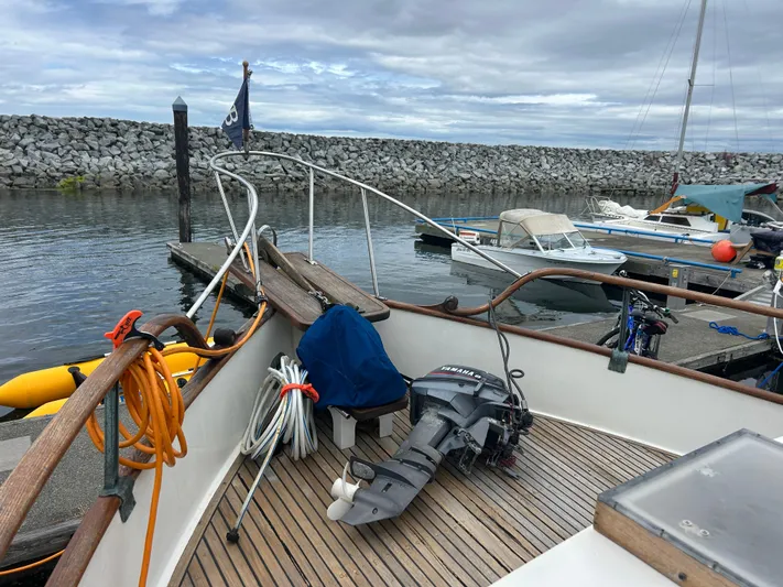 Brie Yacht Photos Pics 1980 Grand Banks 36 Classic boat docked, featuring deck equipment and Yamaha outboard motor.