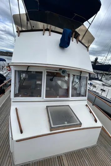 Brie Yacht Photos Pics 1980 Grand Banks 36 Classic yacht with wooden deck and cabin windows.