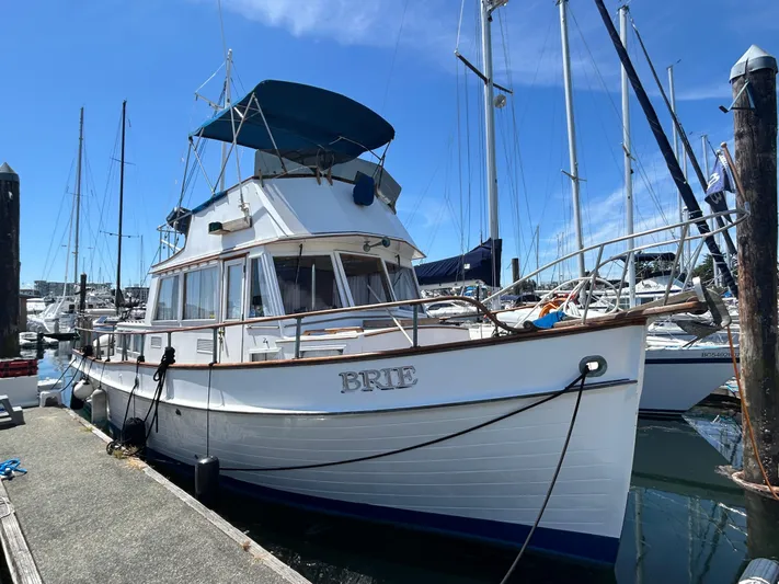 Brie Yacht Photos Pics 1980 Grand Banks 36 Classic yacht docked at marina under clear blue sky.