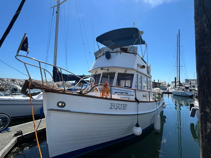 Brie Yacht Photos Pics 1980 Grand Banks 36 Classic boat docked in a marina under clear blue skies.