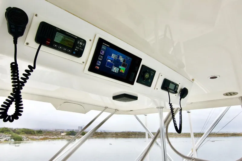 Tres Juanes Yacht Photos Pics Control panel of a 1997 Bertram 54 Convertible yacht with navigation equipment.