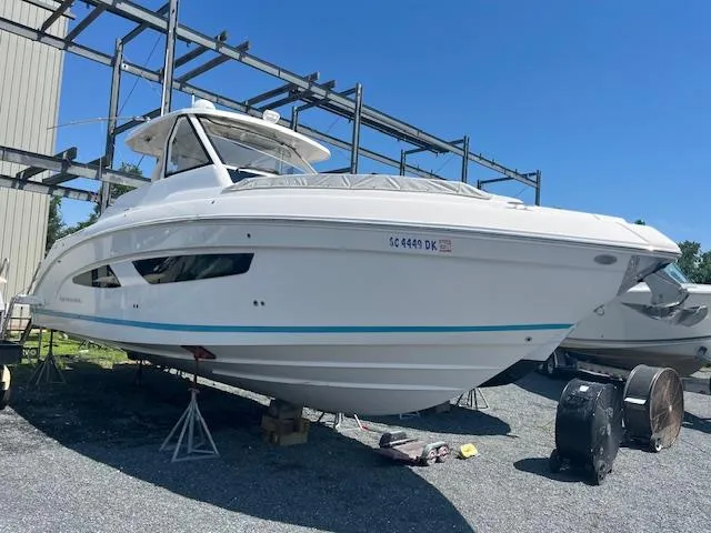  Yacht Photos Pics 2019 Regal 33 SAV boat on stands in a storage yard.