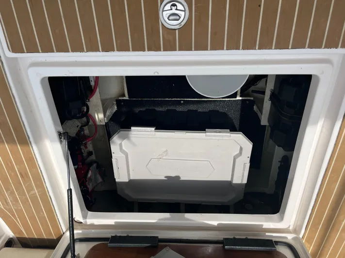  Yacht Photos Pics 2019 Regal 33 SAV boat storage compartment with open hatch and visible equipment.