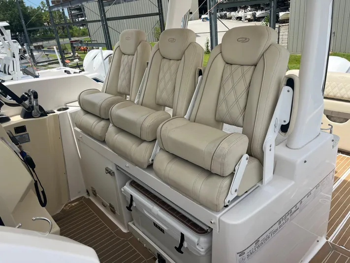  Yacht Photos Pics 2019 Regal 33 SAV boat with three luxurious beige seats and modern interior design.