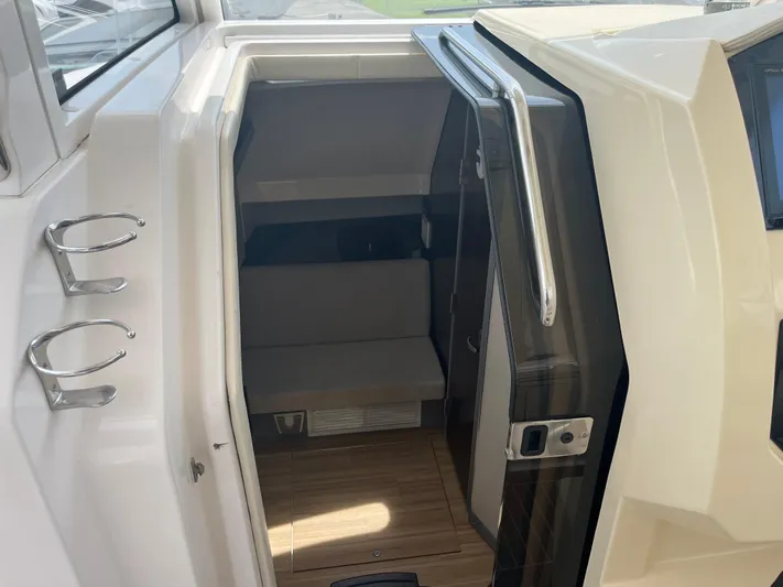  Yacht Photos Pics 2019 Regal 33 SAV cabin entrance with sleek interior and modern design.