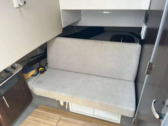  Yacht Photos Pics 2019 Regal 33 SAV interior with beige seating and wooden flooring.