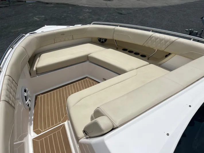  Yacht Photos Pics Luxurious seating area on a 2019 Regal 33 SAV boat with beige cushions.