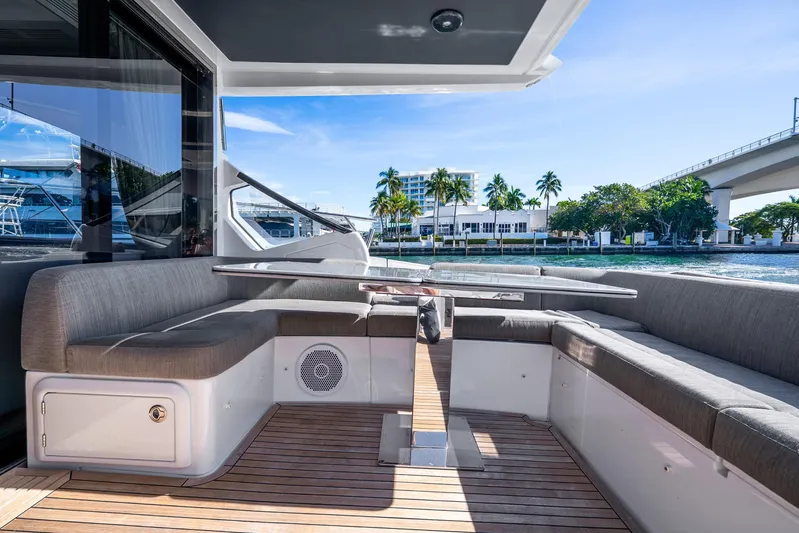 Azure Yacht Photos Pics Luxurious 2021 Azimut S6 yacht deck with elegant seating and scenic waterfront view.