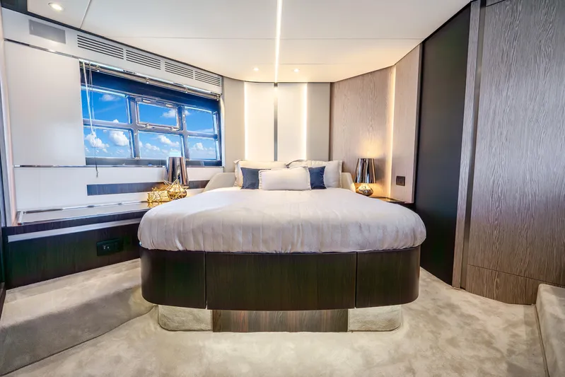 Azure Yacht Photos Pics Luxurious bedroom interior of 2021 Azimut S6 yacht with modern design and large windows.