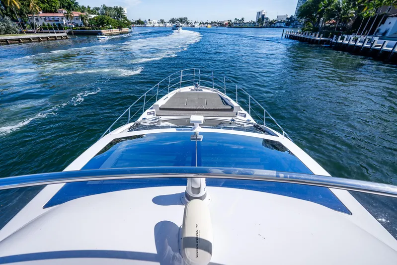 Azure Yacht Photos Pics Front view of 2021 Azimut S6 yacht cruising on a scenic waterway.