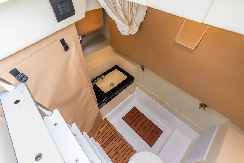 Azure Yacht Photos Pics 2021 Azimut S6 yacht interior with compact bathroom and modern sink design.