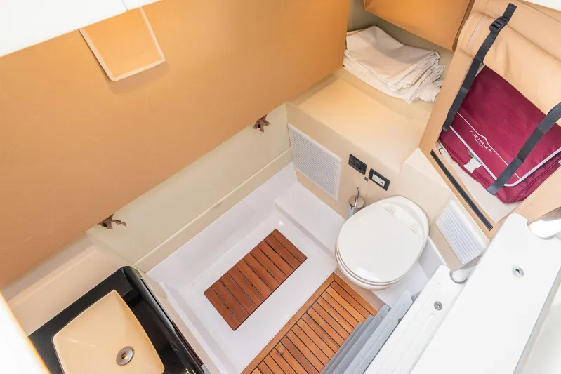 Azure Yacht Photos Pics 2021 Azimut S6 yacht bathroom with modern fixtures and wooden accents.