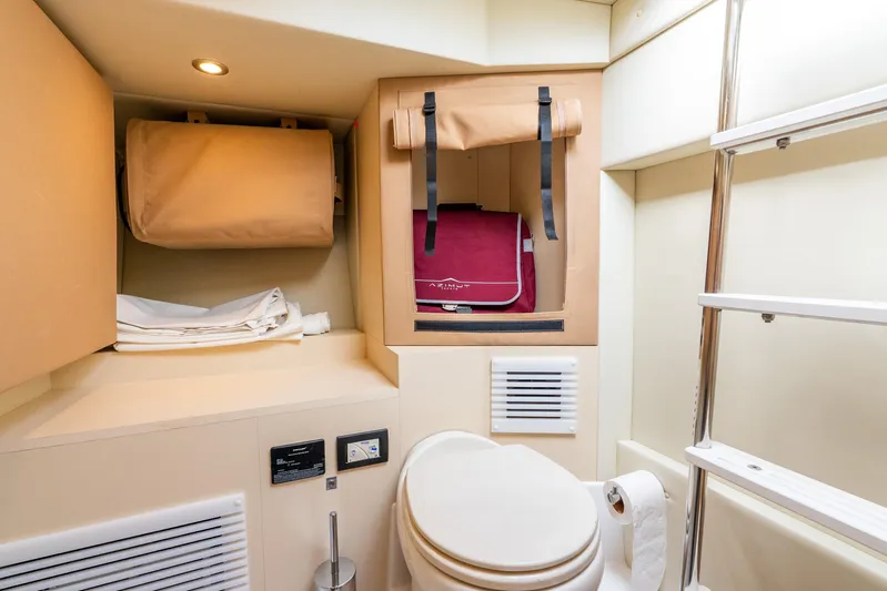 Azure Yacht Photos Pics 2021 Azimut S6 yacht bathroom with storage, ladder, and modern fixtures.