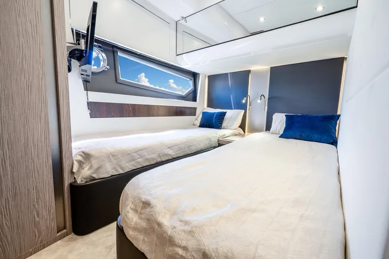 Azure Yacht Photos Pics Luxurious 2021 Azimut S6 yacht cabin with twin beds and modern decor.
