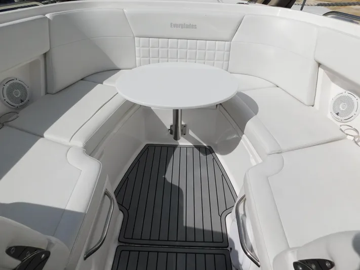 Out To Lunch Yacht Photos Pics 2019 Everglades 340 DC boat interior with white seating and round table.