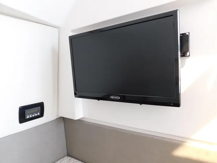 Out To Lunch Yacht Photos Pics Flat-screen TV in the cabin of a 2019 Everglades 340 DC boat.