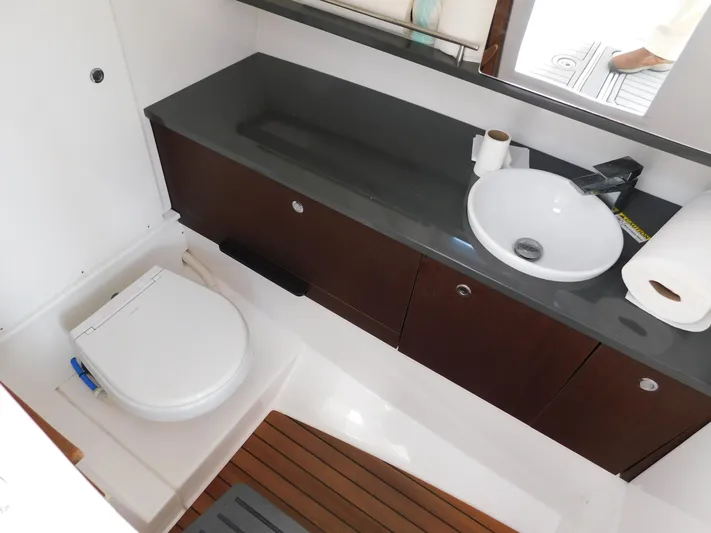 Out To Lunch Yacht Photos Pics 2019 Everglades 340 DC boat bathroom with modern sink and toilet.