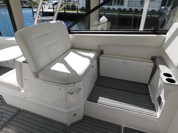 Out To Lunch Yacht Photos Pics 2019 Everglades 340 DC boat interior with white seating and gray flooring.