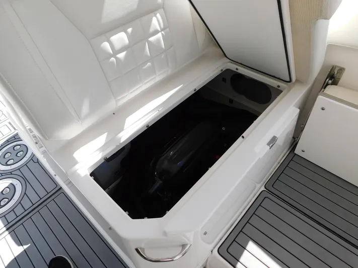 Out To Lunch Yacht Photos Pics Storage compartment in 2019 Everglades 340 DC boat with open lid.