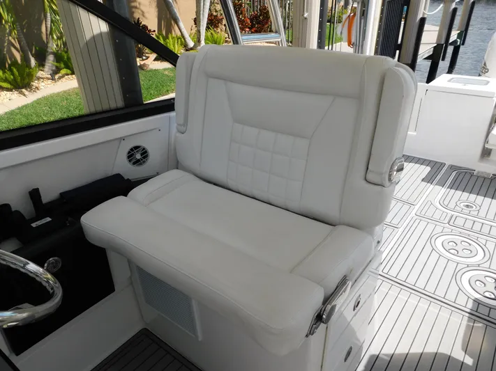 Out To Lunch Yacht Photos Pics 2019 Everglades 340 DC boat interior with white cushioned seating.