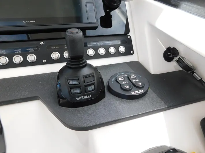 Out To Lunch Yacht Photos Pics Control panel of 2019 Everglades 340 DC boat with Yamaha joystick and Garmin display.