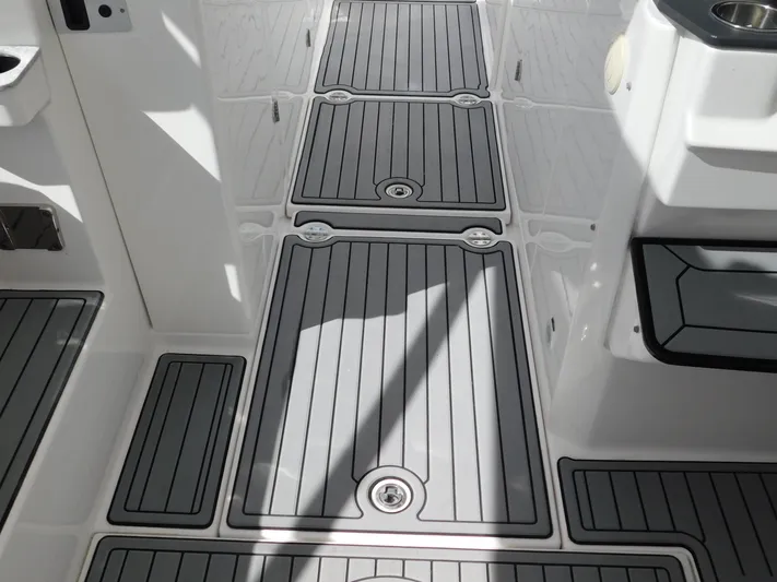 Out To Lunch Yacht Photos Pics 2019 Everglades 340 DC boat deck with gray non-slip flooring.