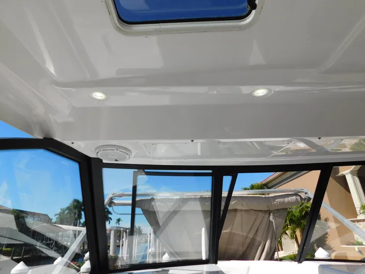 Out To Lunch Yacht Photos Pics Interior view of 2019 Everglades 340 DC boat with sunroof and windows.