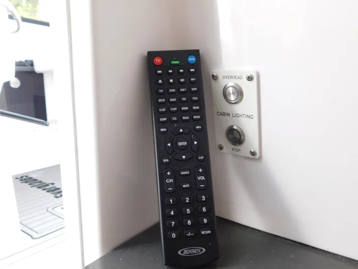 Out To Lunch Yacht Photos Pics Remote control and cabin lighting switch on a 2019 Everglades 340 DC boat.