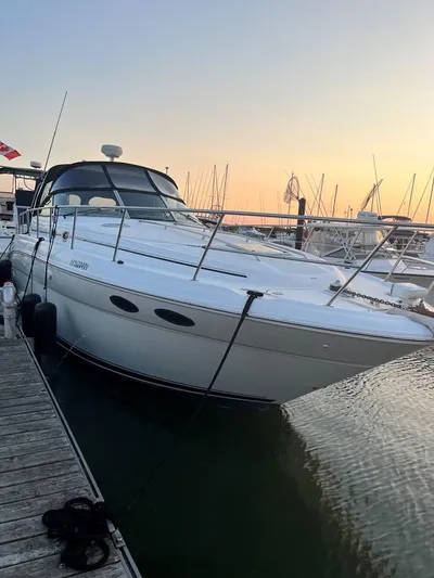  Yacht Photos Pics 2001 Sea Ray 380 Sundancer docked at sunset, showcasing sleek design and luxury features.