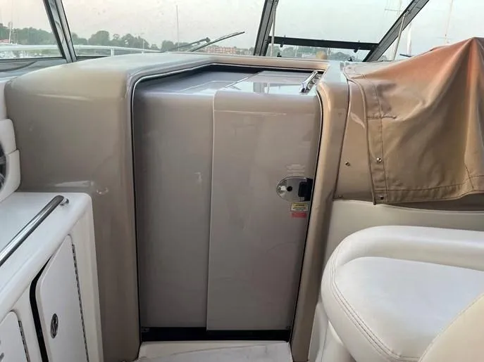  Yacht Photos Pics 2001 Sea Ray 380 Sundancer interior with beige seating and dashboard.