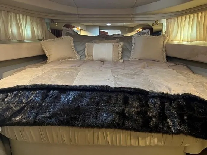  Yacht Photos Pics Luxurious bedroom interior of 2001 Sea Ray 380 Sundancer yacht with plush bedding.