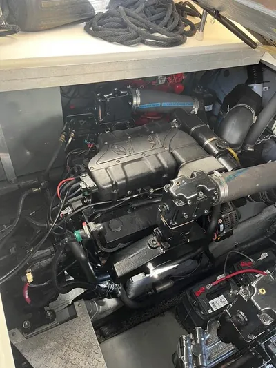  Yacht Photos Pics Engine compartment of a 2001 Sea Ray 380 Sundancer boat, showcasing detailed mechanical components.