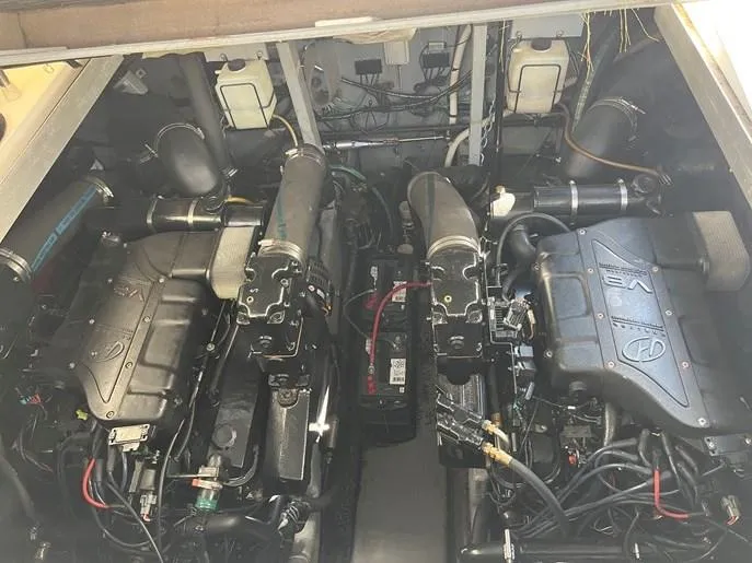  Yacht Photos Pics Engine compartment of a 2001 Sea Ray 380 Sundancer boat, showcasing dual engines.