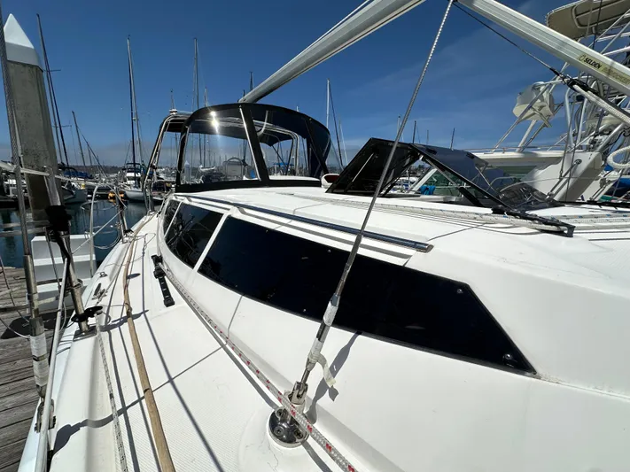 Wind Hunter Yacht Photos Pics 2013 Hunter 33 sailboat docked at marina under clear blue sky.