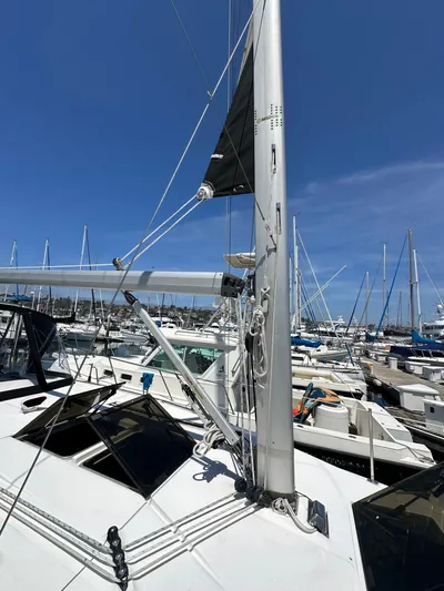 Wind Hunter Yacht Photos Pics 2013 Hunter 33 sailboat docked in marina, clear blue sky, multiple boats in background.