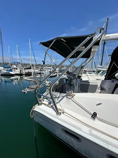 Wind Hunter Yacht Photos Pics 2013 Hunter 33 sailboat docked in marina with blue sky background.