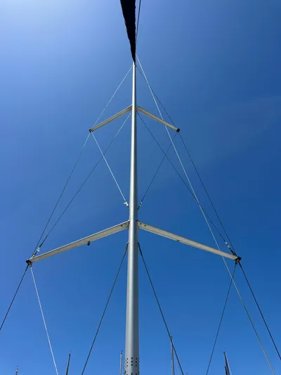 Wind Hunter Yacht Photos Pics Mast of 2013 Hunter 33 sailboat against clear blue sky.