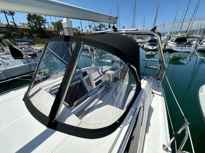 Wind Hunter Yacht Photos Pics 2013 Hunter 33 sailboat with black canopy docked in marina.