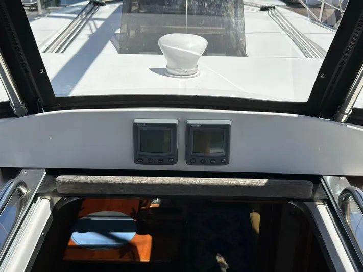 Wind Hunter Yacht Photos Pics Cockpit view of 2013 Hunter 33 sailboat with navigation instruments and hatch.