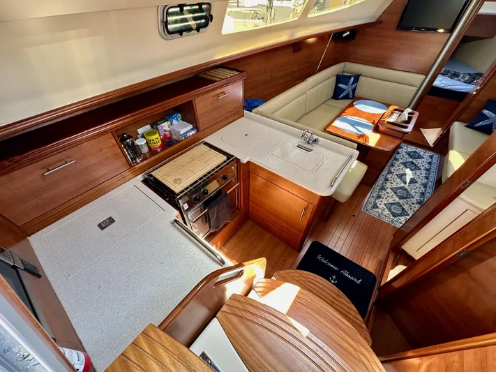 Wind Hunter Yacht Photos Pics 2013 Hunter 33 yacht interior with modern kitchen and cozy seating area.