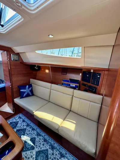 Wind Hunter Yacht Photos Pics Interior of 2013 Hunter 33 yacht with beige seating and nautical decor.