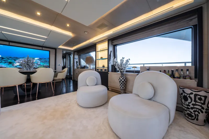 Horizon Yacht Photos Pics Luxurious interior of a 2016 Benetti 93' yacht with elegant seating and modern decor.