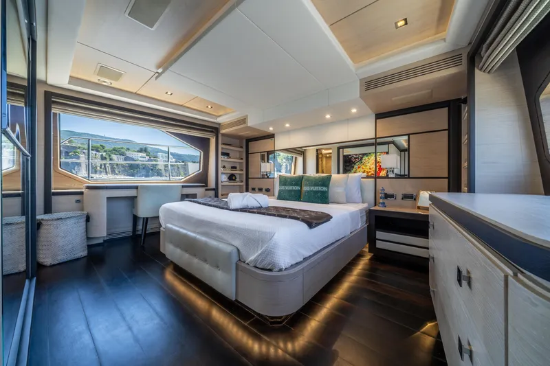 Horizon Yacht Photos Pics Luxurious bedroom interior on a 2016 Benetti 93' yacht with scenic window view.