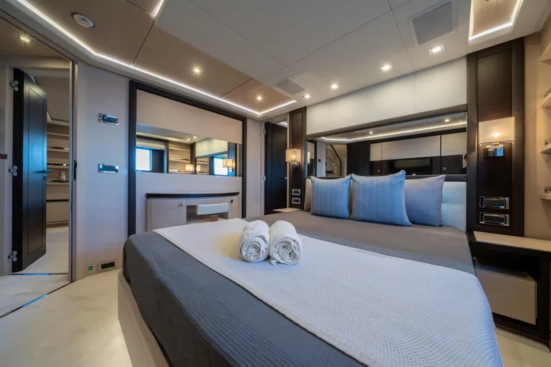 Horizon Yacht Photos Pics Luxurious bedroom interior on a 2016 Benetti 93' yacht, featuring elegant design and modern amenities.