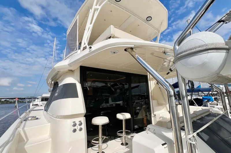 Tonga Time Yacht Photos Pics 2019 Aquila 44 yacht with modern design, featuring outdoor seating and sleek architecture.