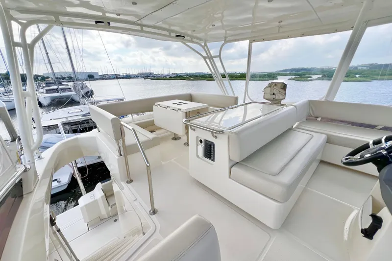 Tonga Time Yacht Photos Pics Luxurious 2019 Aquila 44 yacht interior with spacious seating and scenic marina view.