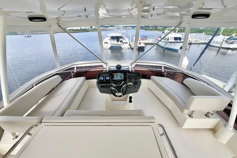 Tonga Time Yacht Photos Pics Luxurious 2019 Aquila 44 yacht helm with panoramic marina view.